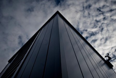 Worms Eye View Of Building Under White Cloudy Sky photo