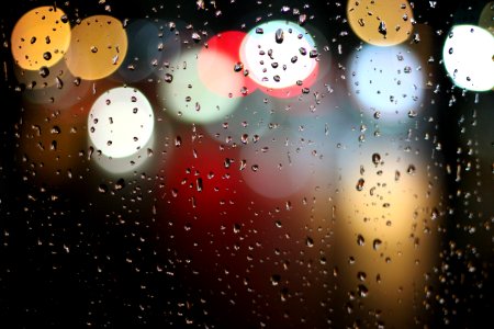 Bokeh Lights Through Rainy Window photo