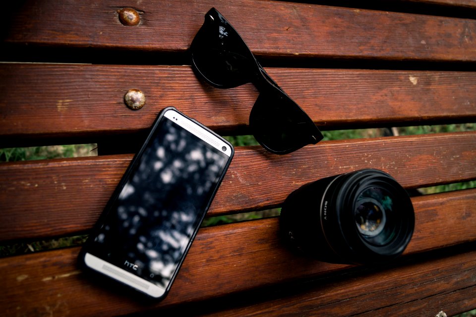 Black Wayfarer Sunglasses Near The Camera Lens