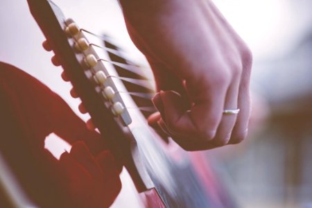 Person Playing Guitar