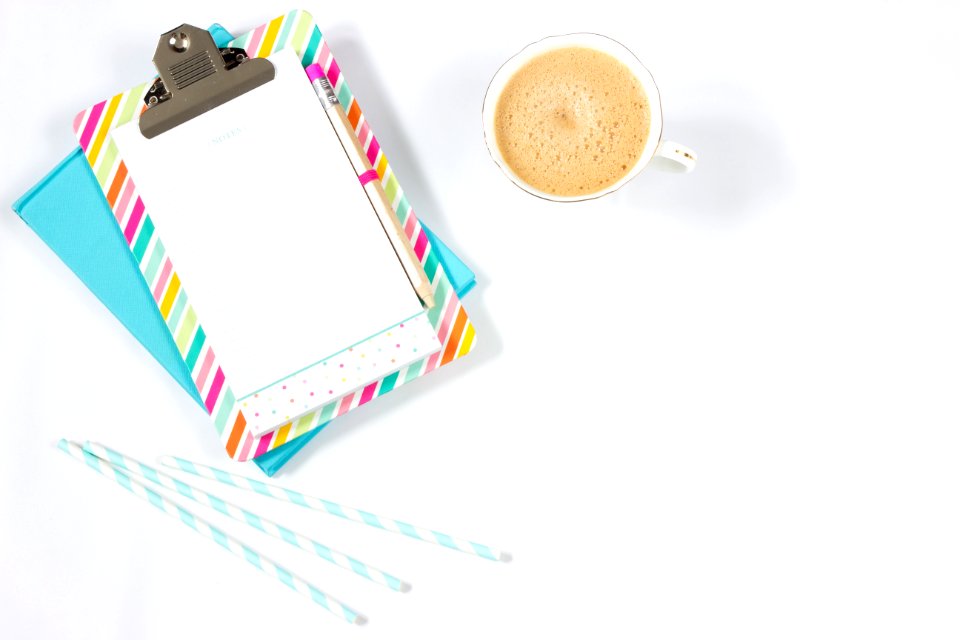 White Ceramic Teacup Beside Grey Paper Clip
