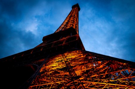 Eiffel Tower Under Cloudy Sky During Nighttime photo