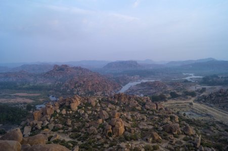 Overlooking View Of Brown Rocks And Green Plants