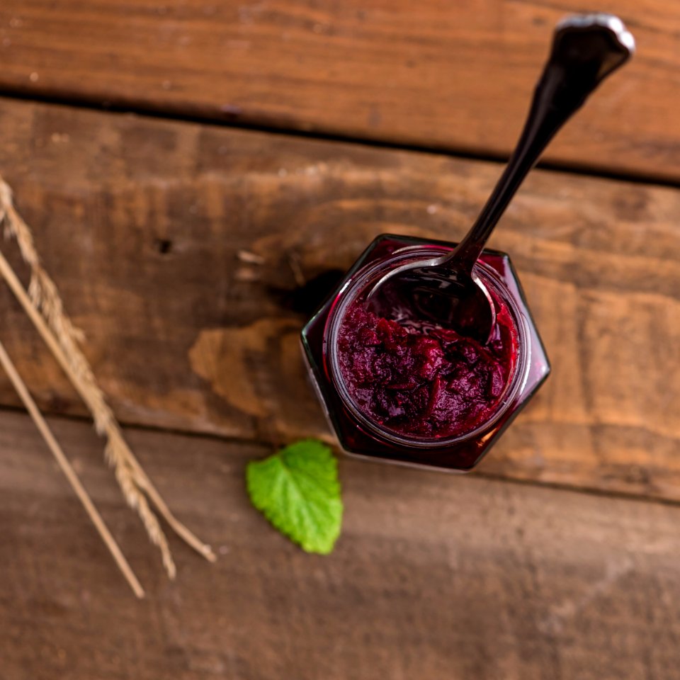 Silver Spoon On Red Syrup In Top View Photography