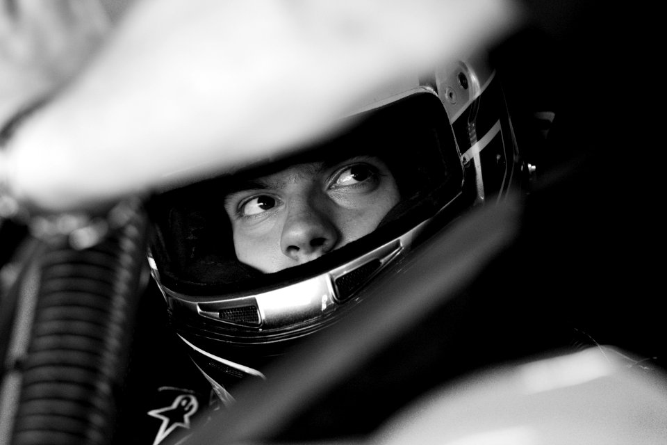 Gray Scale Image On Man Wearing Full Face Helmet