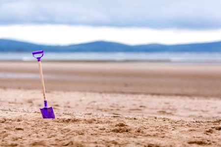 Purple Shovel On Sand Bottom Focus Camera
