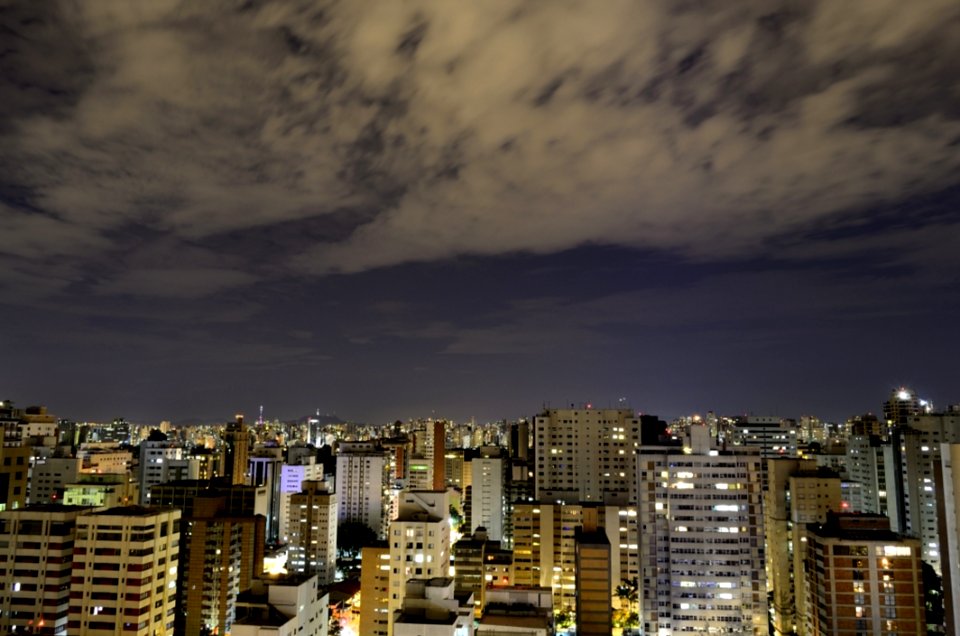 Aerial View Of City With High Rise Building At Night Time