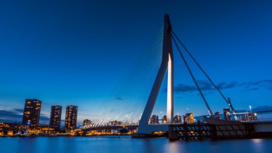 Suspension Bridge Over River At Twilight photo