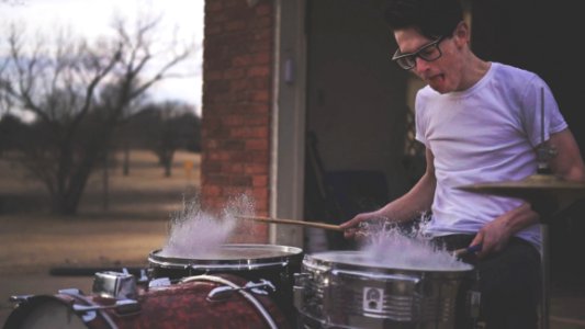 Person Playing On Drums During Daytime photo