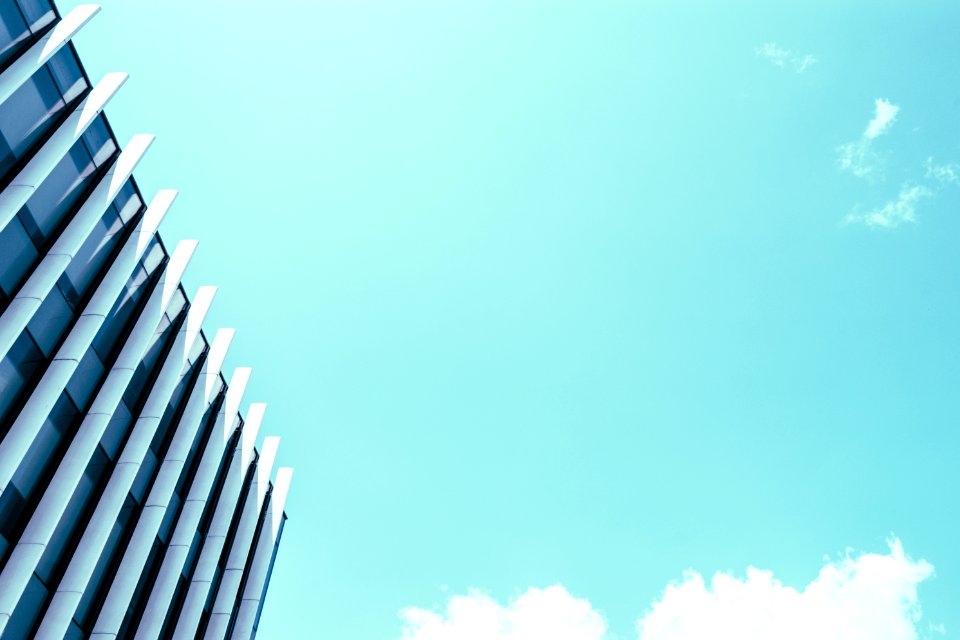 High Rise Building Under White Clouds And Blue Sky