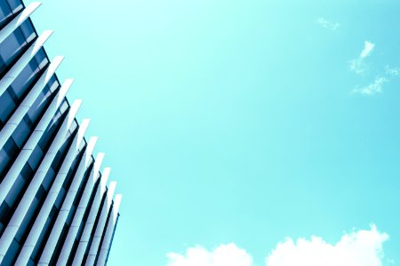 High Rise Building Under White Clouds And Blue Sky photo