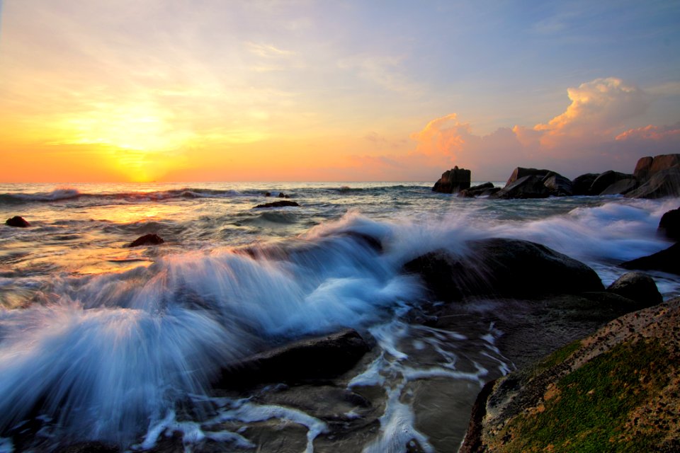 Waves On Rocky Shores At Sunrise photo