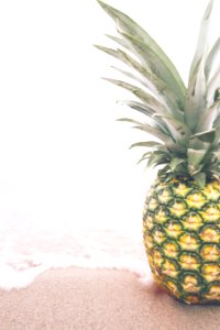 Fresh Pineapple On Beach photo