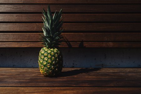 Pineapple On Wooden Bench photo