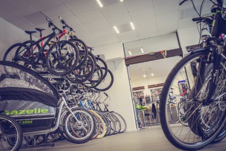 Bicycle Hanged And Piled On Bicycle Shop photo