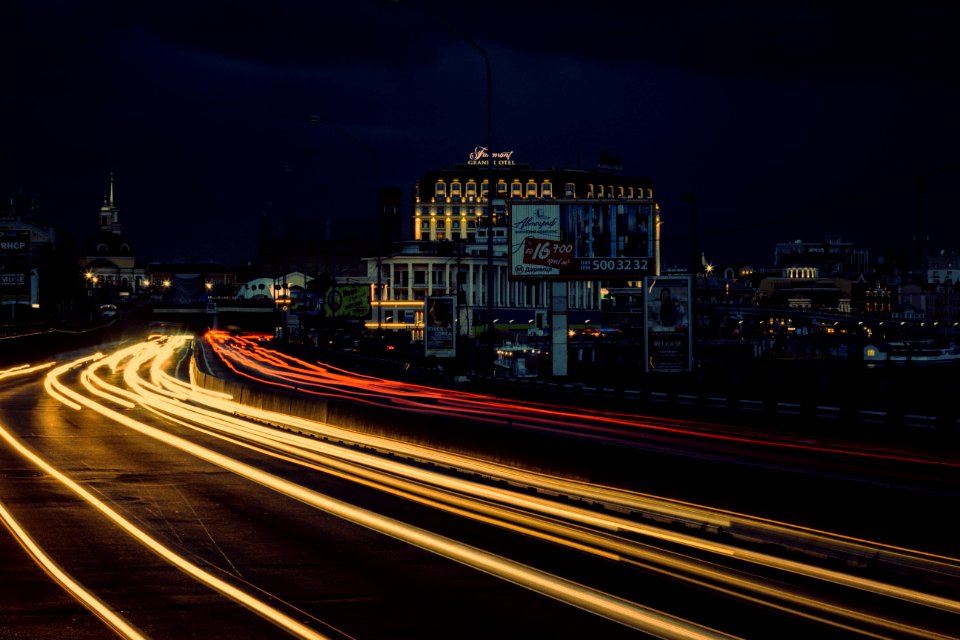 Timelapse Photography Of Street With Vehicle Moving During Night Time