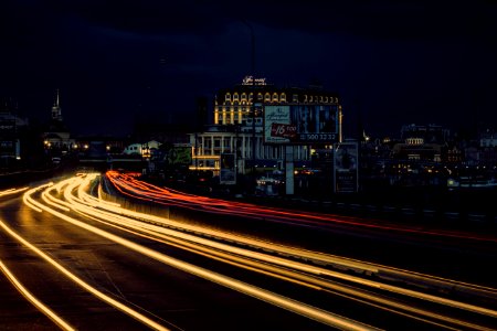 Timelapse Photography Of Street With Vehicle Moving During Night Time photo