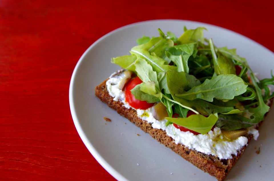 Baked Pastry With Cream And Salad On Top