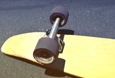Brown Skateboard On Concrete Road