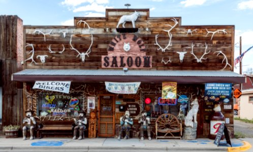 The distinctive White Wolf Saloon in Douglas, site of the annual Wyoming State Fair. The bar's owners, Diane and Carl Strode, who had lived in distant Miami, Florida, bought the closed establishment, bereft of fixtures, and gradually furnished it with colorful furnishings, Old West figures, and animal trophies and horns. Original image from Carol M. Highsmith’s America, Library of Congress collection. photo