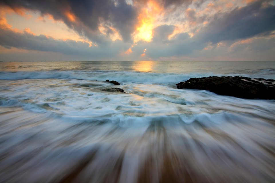 Time Lapse Photo Of Water Current And Brown Rock Under White And Yellow Cloudy Sky