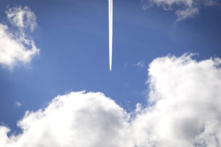 Airplane Streak In Sky photo