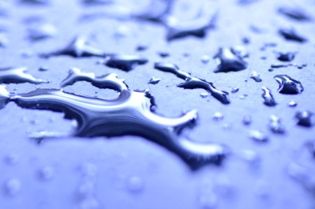 Dew Drops Of Water On Blue Surface