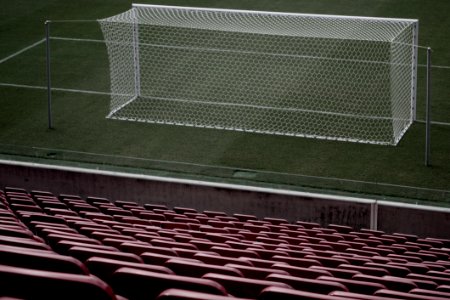 Stadium Seats Near White Soccer Goal photo