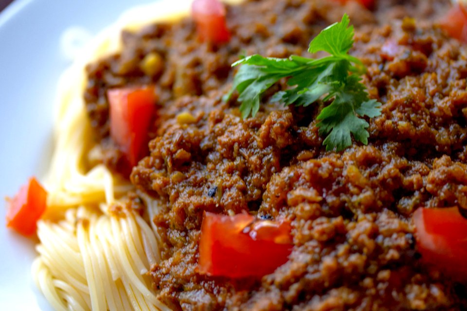 Cooked Pasta With Sliced Tomatoes And Green Leafy