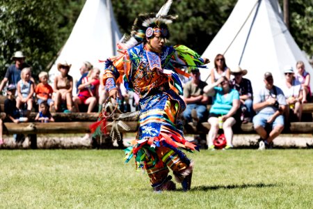 Scene from authentic Native American dances at the Indian Village on the rodeo grounds of the Cheyenne Frontier Days celebration in the Wyoming capital city. The Western celebration that is viewed by an estimated 200,000 onlookers, including throngs of tourists, each year in a city of 62,000 people (as of 2015) includes one of the West's most celebrated rodeos, American Indian pageantry, free pancake breakfasts, several Old West-themed parades, and other events. Cheyenne Frontier Days have been a mountain-states tradition since 1897. Original image from Carol M. Highsmith’s America, Library of Congress collection. photo