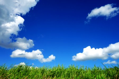 Clouds In Blue Sky Over Field