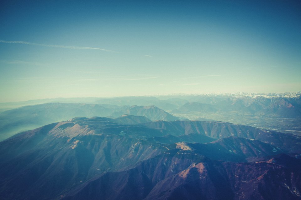 Aerial Photography Of Mountain Under Sunny Blue Sky