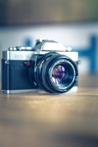 Shallow Focus Photography Of Black And Silver Slr Camera photo