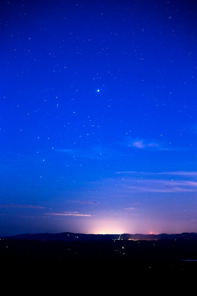 Silhouette Of Mountain Range Under Stars