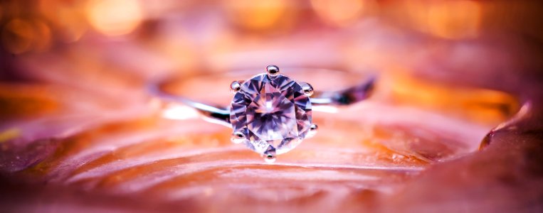 Close Up Photo Of Grey And Diamond Ring photo