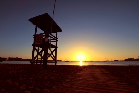 Lifeguard Chair On Beach At Dawn photo