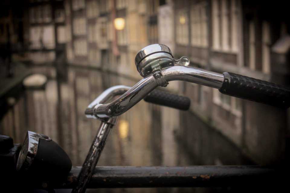 Black And Gray Bicycle Handle Bar With Bell Near Canal