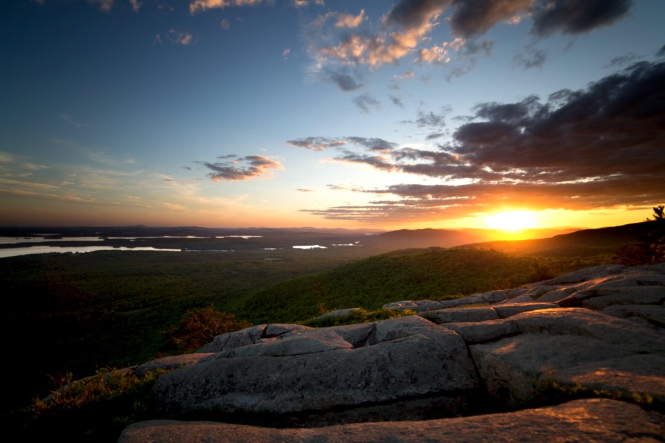 View Of Green Grass Land And Sunset During Daytime