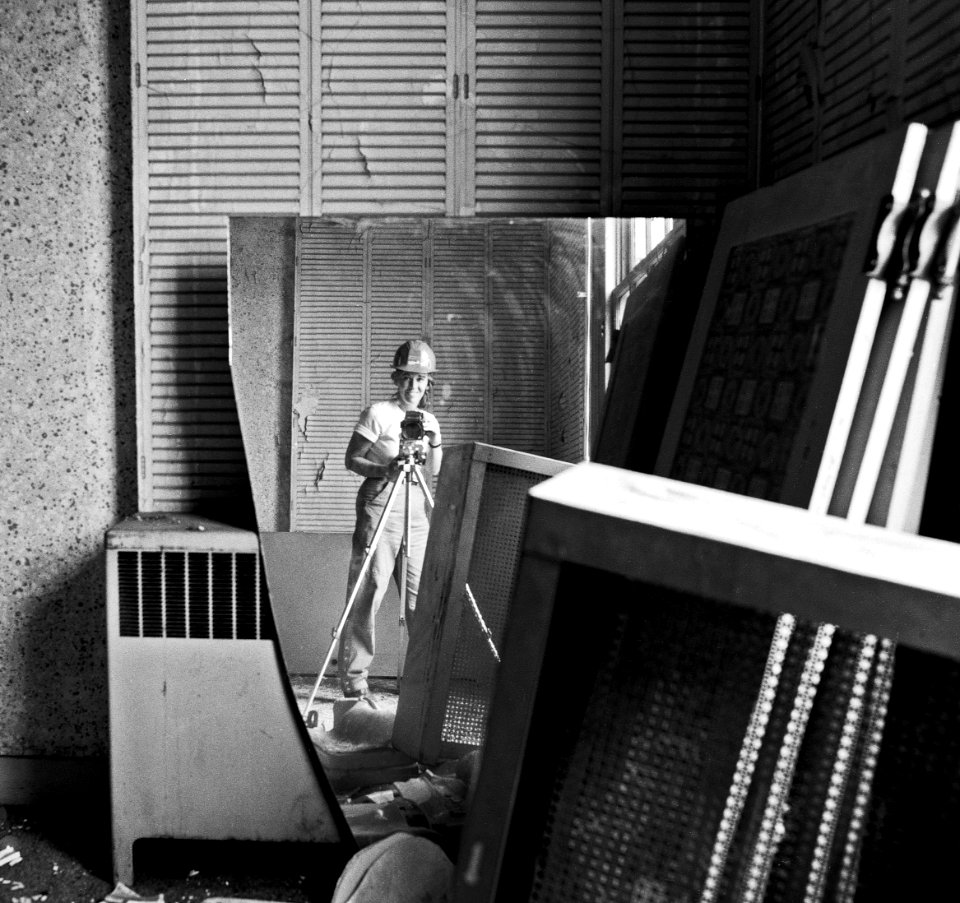 Woman taking a selfie with a mirror