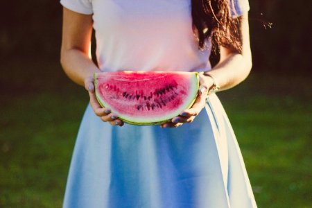 Woman In White And Blue Dress Holding Water Melon photo