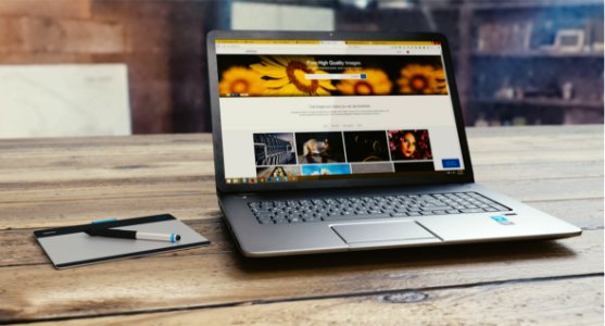 Laptop Computer On Wooden Table