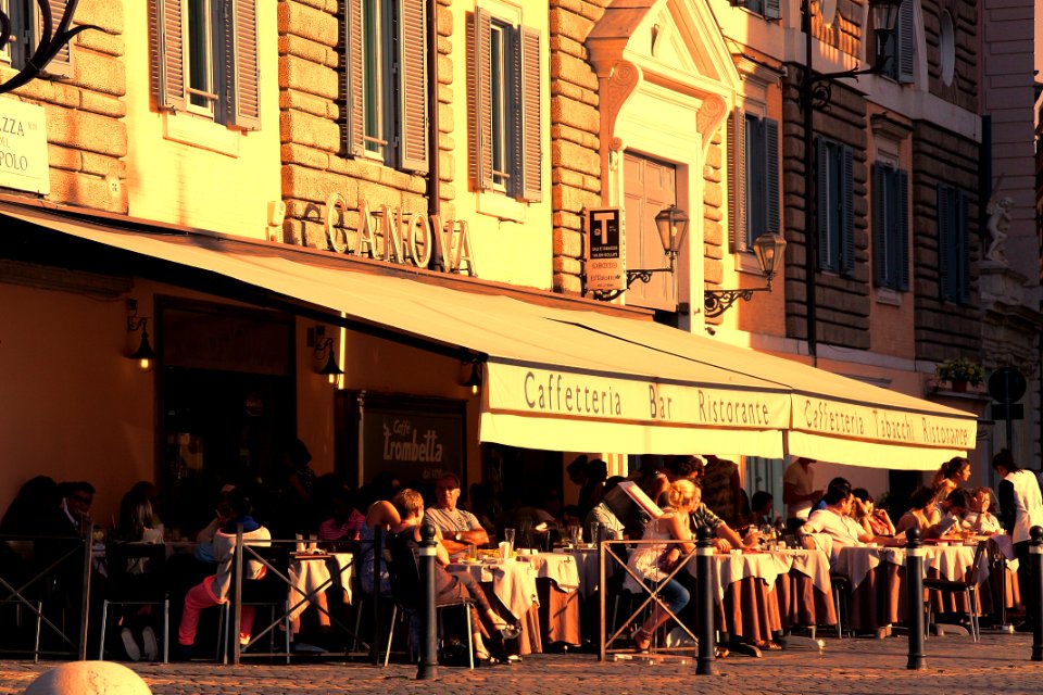 People Sitting Outside Caffetteria During Daytime