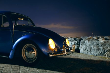 Blue Volkswagen Beetle Car Near Cliff During Night Time photo