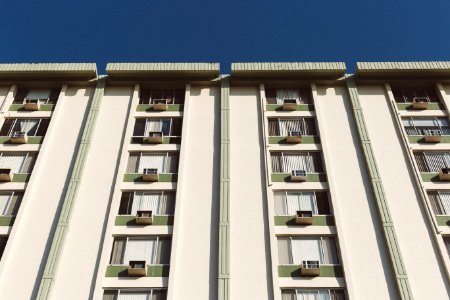 White Painted Residential Building Under Clear Skies photo