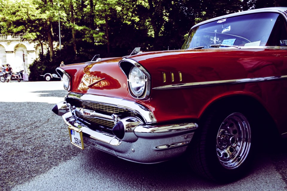 Red And Gray Vintage Car On Gray Concrete Road During Daytime