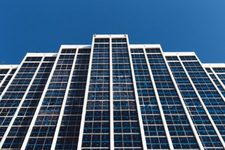 White And Blue High Rise Building Under Blue Sky During Daytime