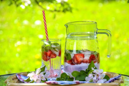 Clear Glass Pitcher With Water And Strawberry photo