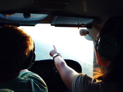 Persons On Aircraft Pointing On View During Daytime