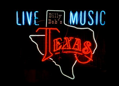 Neon sign outside a bar -- not Billy Bob's, which is a separate night club and dance hall nearby -- in the Stockyards District of Fort Worth. The neighborhood celebrates a former livestock market that operated under various owners from 1866. Today the Stockyards consist of mainly entertainment and shopping venues that capitalize on the "Cowtown" image of Fort Worth. They are the last standing stockyards in the United States. Original image from Carol M. Highsmith’s America, Library of Congress collection.