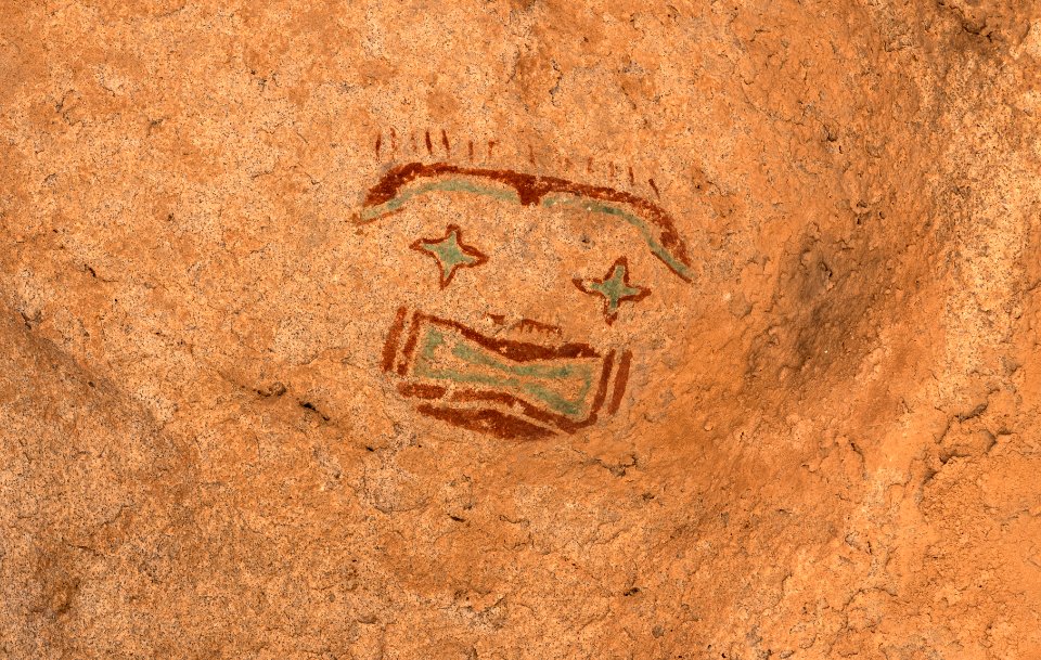 Rock drawings, or pictographs, in a restricted area of Hueco Tanks State Historic Site near El Paso in El Paso County, Texas. The more than 200 "mask drawings" in the park -- the most in North America -- are the artistic legacy of different prehistoric peoples who, over several millennia, found water, feed, and shelter at this stone oasis in the desert. The "tanks" are geological depressions that catch rainwater, attracting animals and human settlement in the otherwise-dry high-desert surroundings. The area shown here is restricted because vandals have desecrated other such drawings with graffiti. Original image from Carol M. Highsmith’s America, Library of Congress collection.